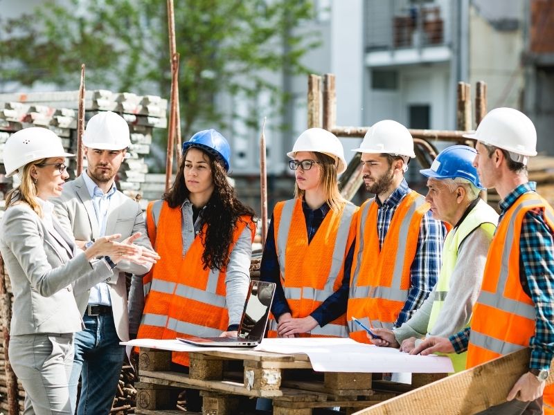 Construction crew gathering for a safety briefing